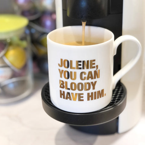 A fine bone china mug, hand-finished with 22 carat gold with a quote saying Jolene, you can bloody have him