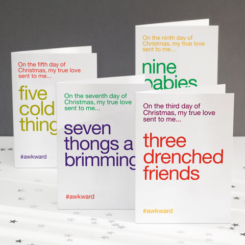 A pack of four greetings cards showing funny alternative lyrics to the twelve days of christmas.
