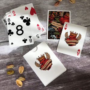A pack of unusual playing cards with a tattoo design theme