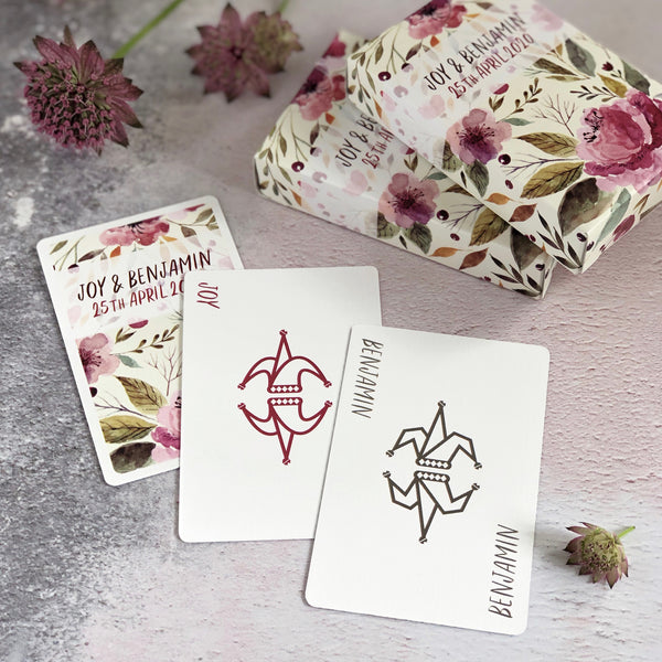 Personalised jokers from playing card wedding favours in a floral design