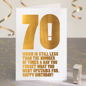A funny 70th birthday card with the text '70, which is still less than the number of times a day you forget what you went upstairs for'.