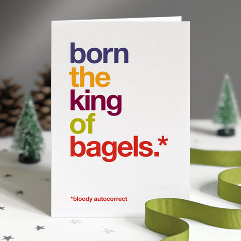 Funny christmas card autocorrected to 'born the king of bagels'.