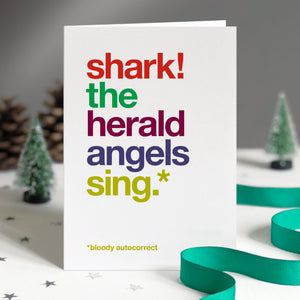 Funny christmas card autocorrected to 'shark the herald angels sing'.