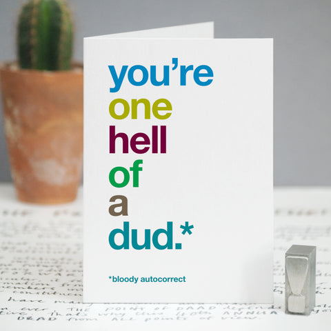 A card with the text 'you're one hell of a dud, bloody autocorrect'.
