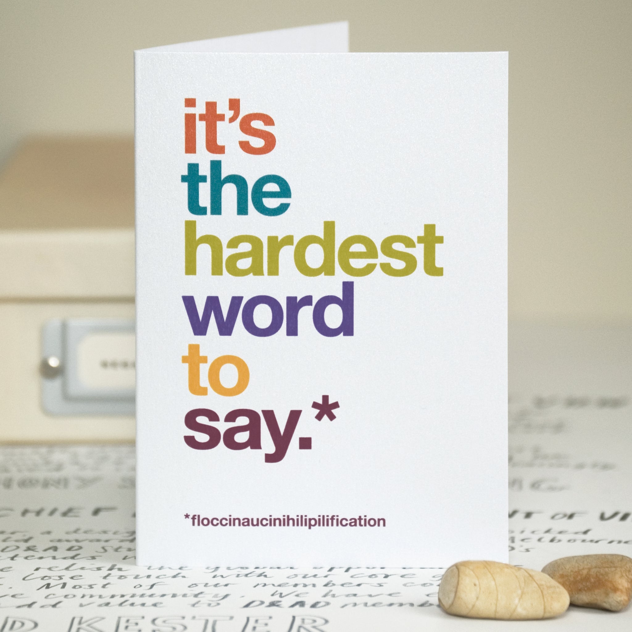 A funny sorry card with the text 'it's the hardest word to say'. At the bottom of the card is the text 'floccinaucinihilipilification'.