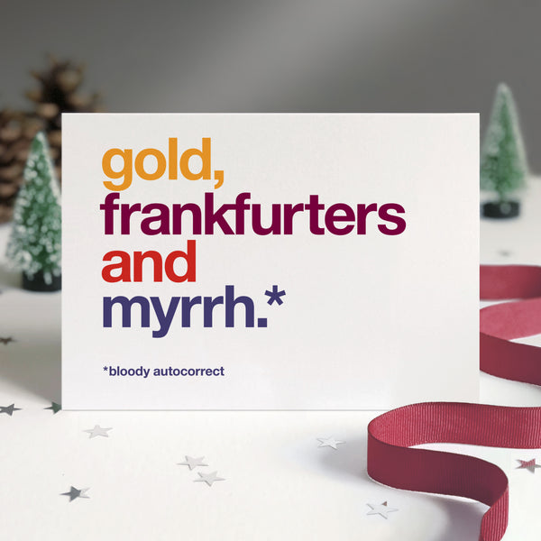 Funny christmas card autocorrected to 'gold, frankfurters and myrrh'.
