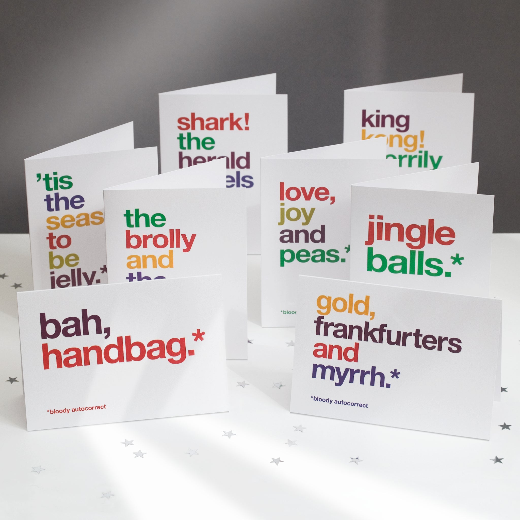A pack of 8 funny autocorrect christmas cards.