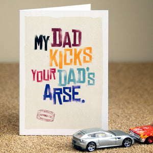 A funny father's day card saying 'my dad kicks your dad's arse'.