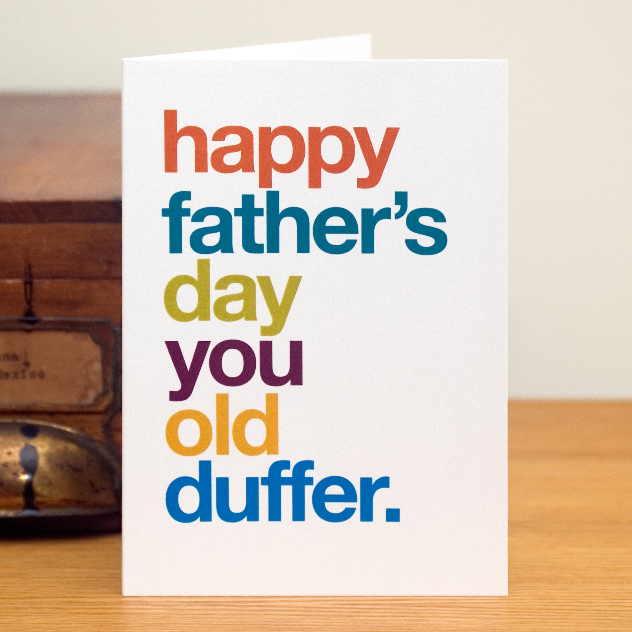 A funny greetings card saying 'happy father's day you old duffer'.