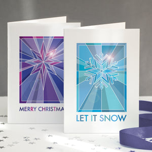 A pack of geometric christmas cards showing a graphic star and snowflake design.