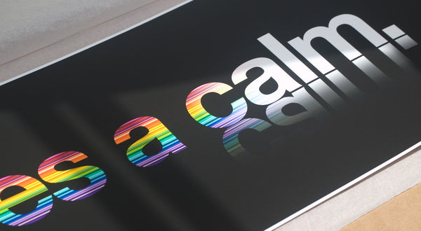 Close up of a typographic rainbow print 