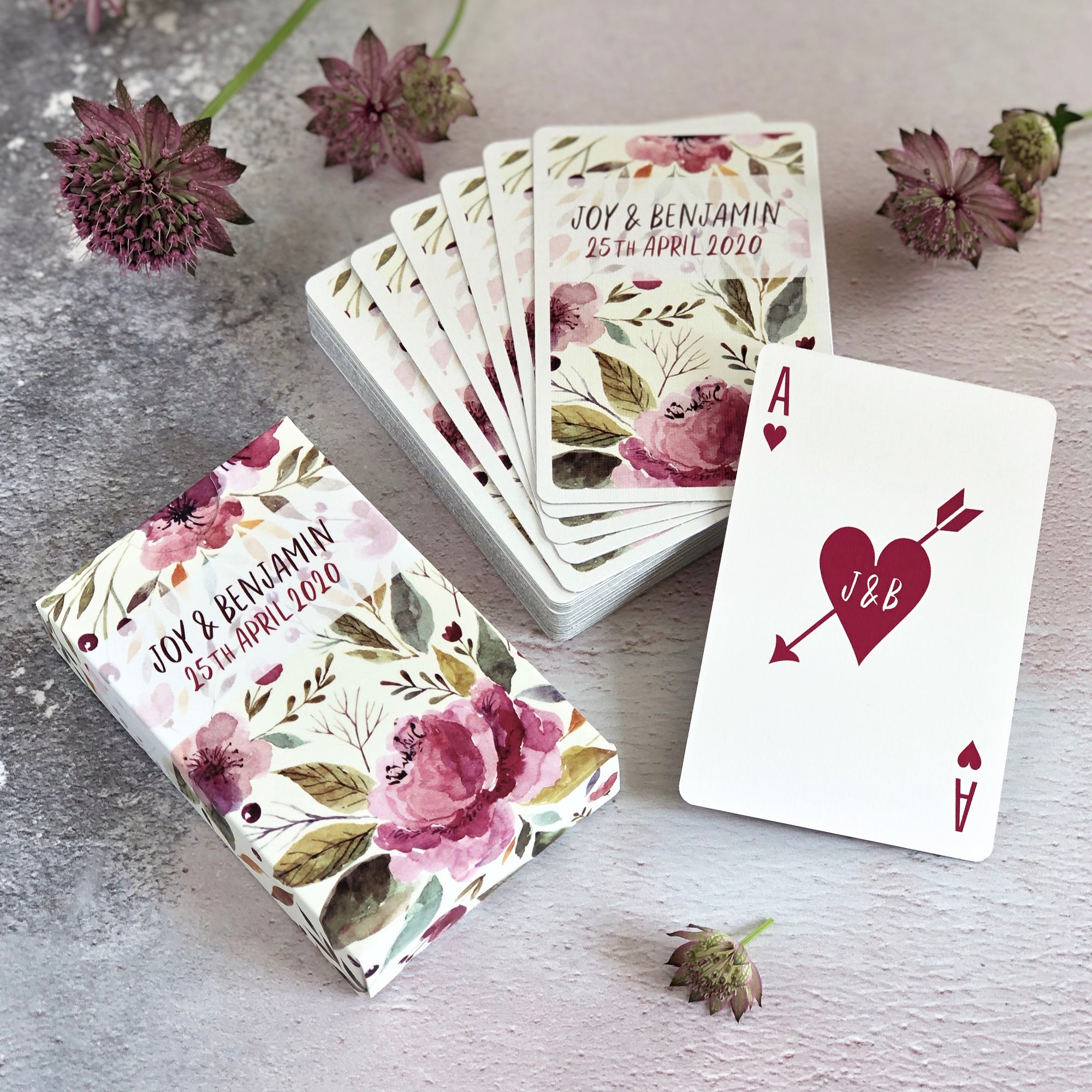 Personalised playing card wedding favours with a floral design