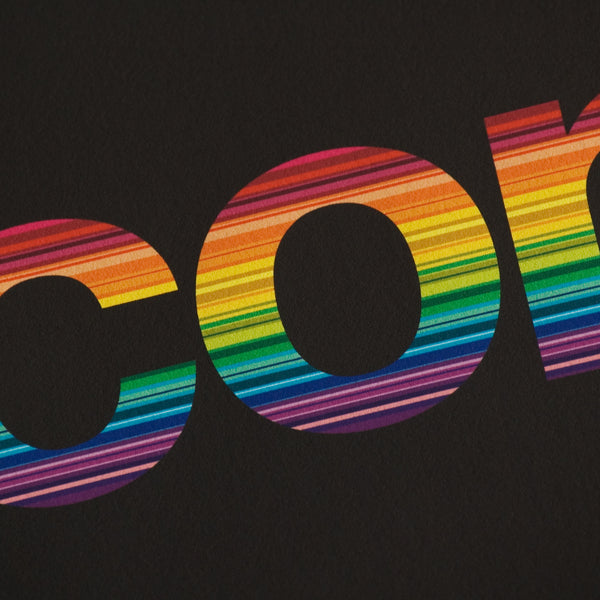 Close detail of colourful lettering on a rainbow print
